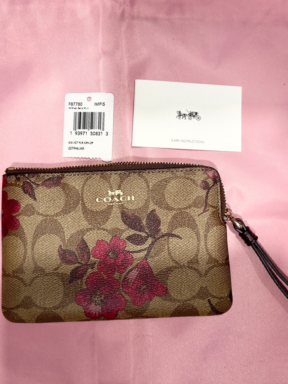 COACH Brown Signature Floral Zip Wristlet with Pink Flowers